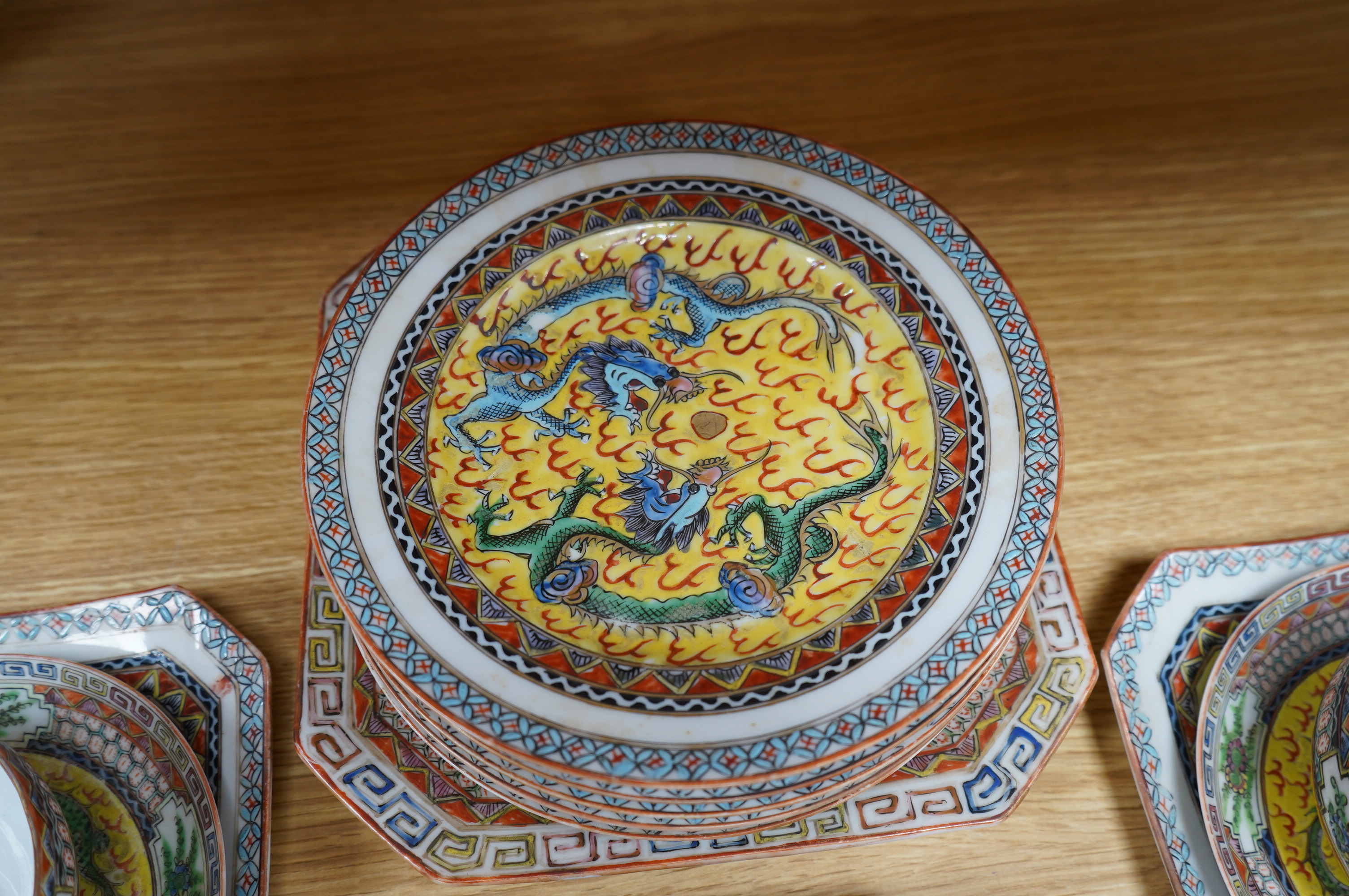 An early 20th century Chinese eggshell porcelain part tea set, with a yellow ground and coloured dragons (22). Condition - cups have slight chipping to top edges